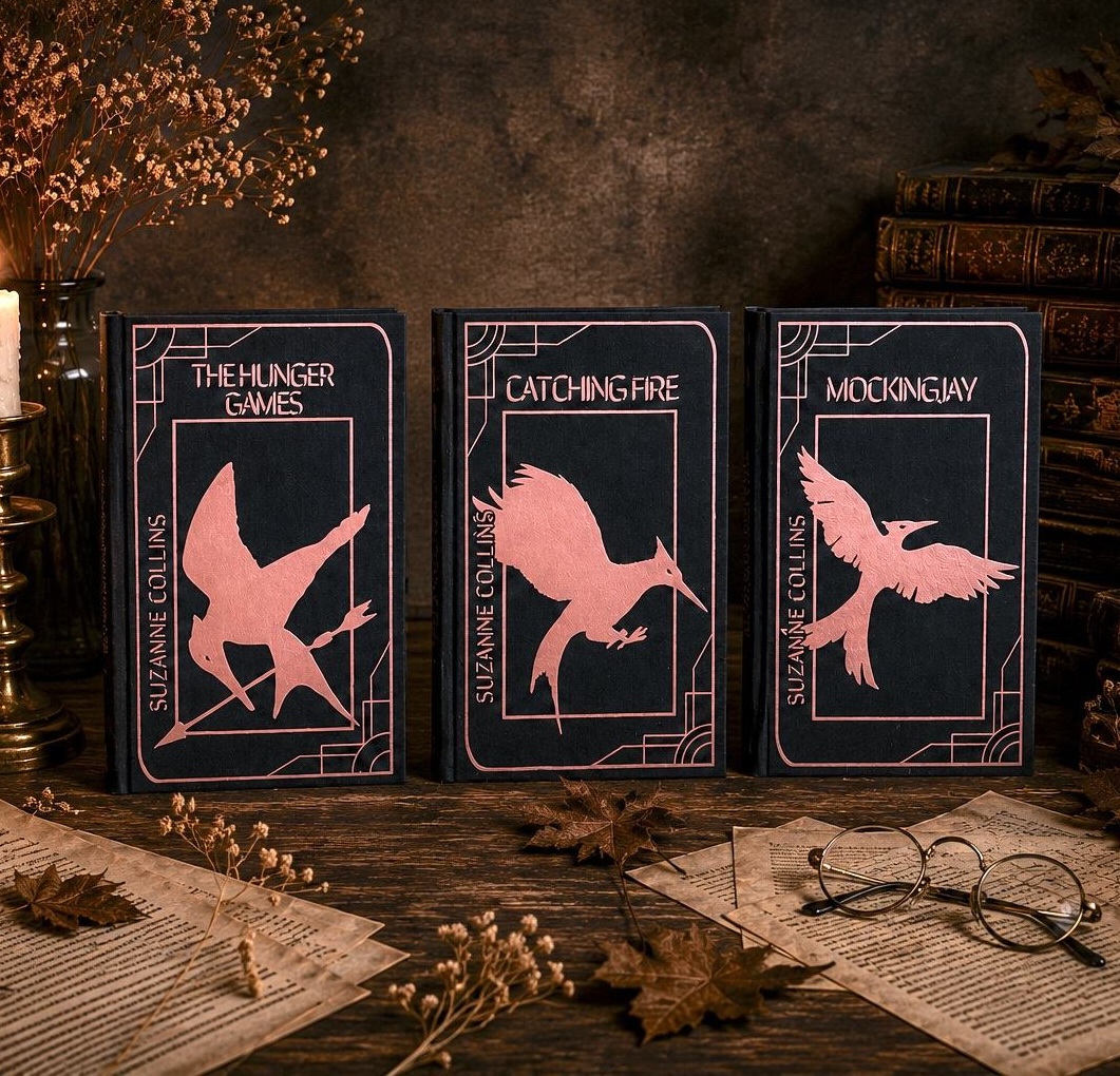 The Hunger Games rebind, black cotton with rose gold foil