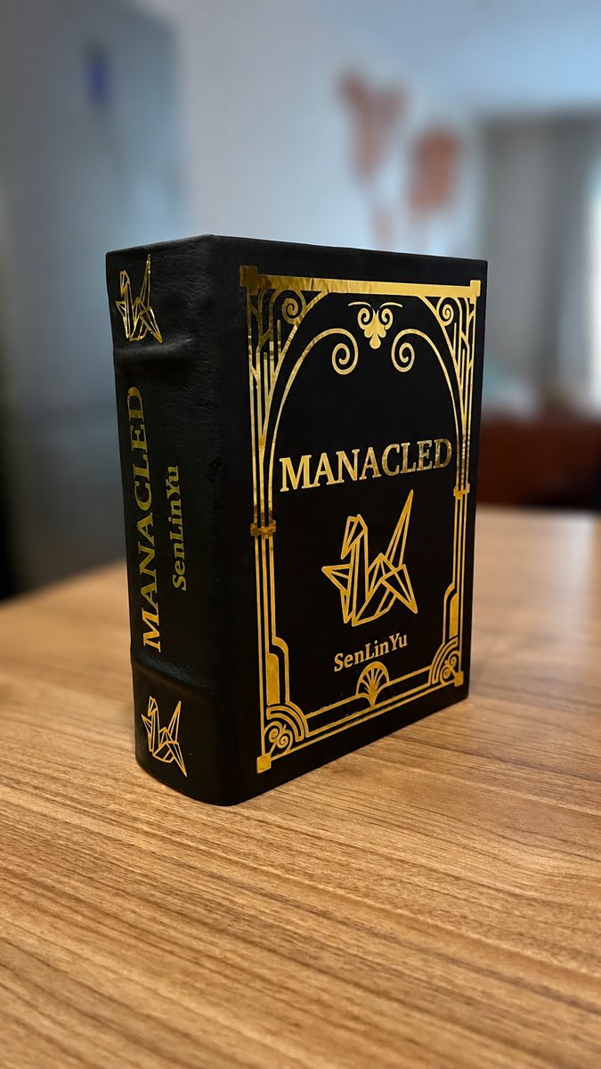 Manacled rebind, leather with gold foil